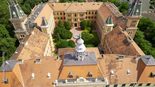 Beautiful aerial view of historic building with lush gardens and unique architecture in a serene setting