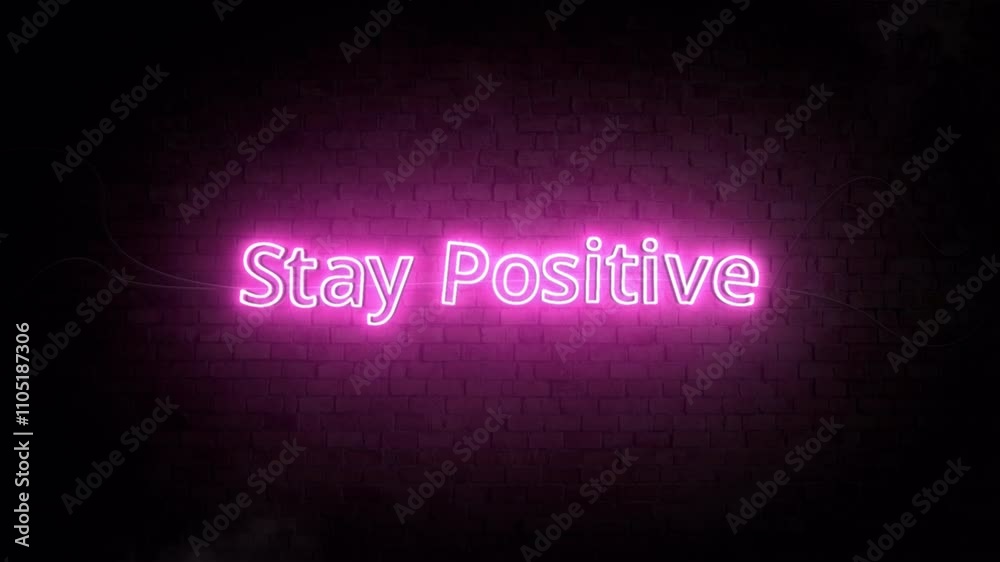 Pink Neon Sign Saying 'Stay Positive' on Dark Brick Wall Background Pink Neon Sign Saying 'Stay Positive' on Dark Brick Wall Background