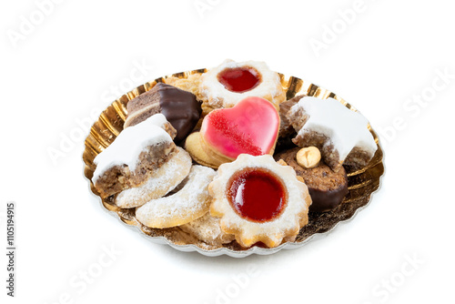 Various Christmas Cookies on a Plate on a wodden table photo