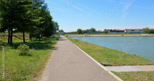 Wallpaper Mural Scenic riverside walk on a sunny day with clear blue skies and lush greenery Torontodigital.ca