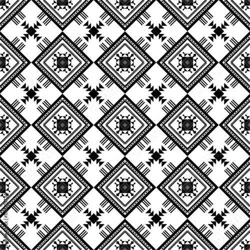 intricate geometric pattern featuring bold colors such as red, green, black, and white. The design includes symmetrical diamond shapes and repeating motifs, possibly influenced by traditional or cultu