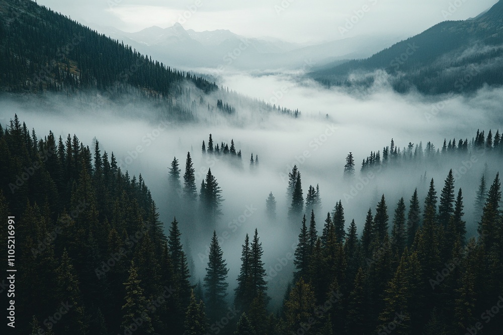Fototapeta premium Misty mountain landscape with snow-capped peaks reflecting in the serene lake