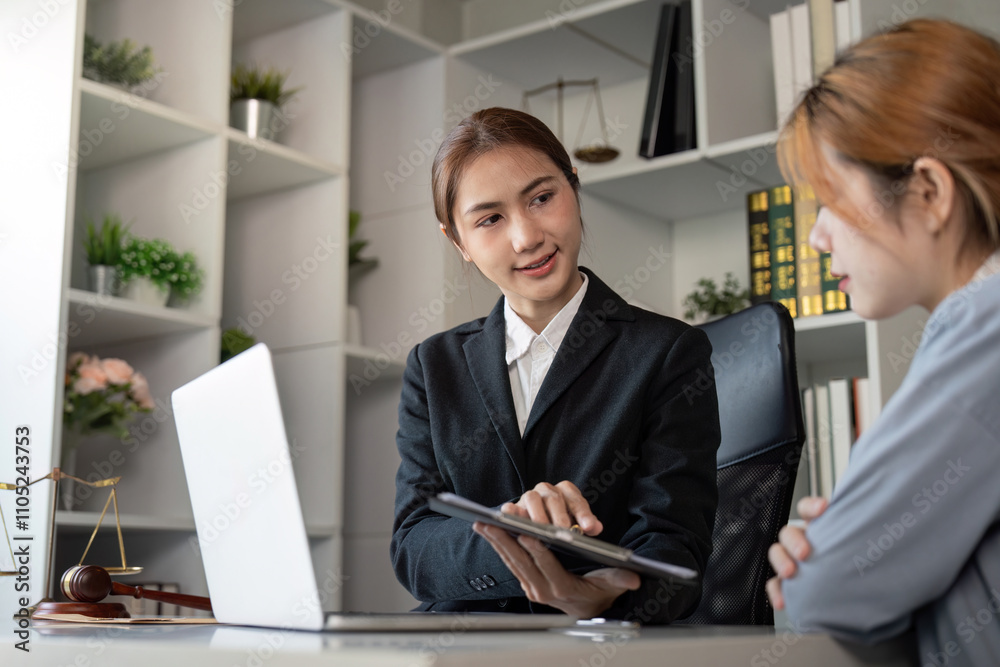 Asian Female Lawyer Explaining Legal Details to Client Asian Female Lawyer Explaining Legal Details to Client