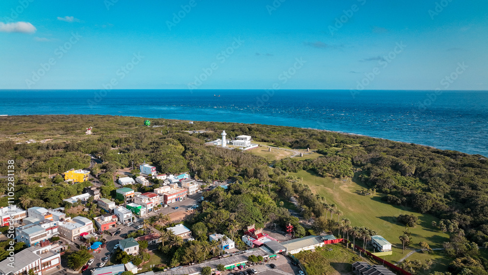 View of Eluanbi Lighthouse surrounded by lush greenery and coastal scenery in Taiwan View of Eluanbi Lighthouse surrounded by lush greenery and coastal scenery in Taiwan