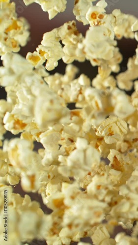 Super slow motion of flying tasty popcorn with camera movement. Filmed on high speed cinema camera, 1000 fps.