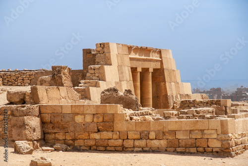 Pyramid complex on Giza plateau. Entrance to Cheops Pyramid, largest of Egyptian pyramids of Ancient Egypt, only one of “Seven Wonders of World” that has survived to this day. Cairo, Egypt.