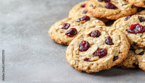 Sweets snacks junk diet food concept. Cookies with cranberries on a grey surface