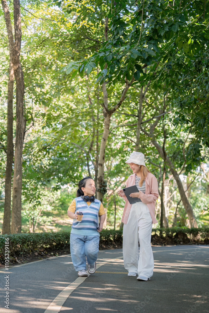 Friendly Interaction Between Two Women Walking in a Park, Embracing Diversity and Inclusion, Highlighting Achondroplasia Awareness Friendly Interaction Between Two Women Walking in a Park, Embracing Diversity and Inclusion, Highlighting Achondroplasia Awareness