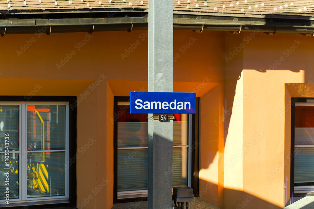 Sign with pole at railway station of mountain village of Samedan in the Swiss Alps on a sunny autumn day. Photo taken November 15th, 2024, Samedan, Switzerland. Sign with pole at railway station of mountain village of Samedan in the Swiss Alps on a sunny autumn day. Photo taken November 15th, 2024, Samedan, Switzerland.