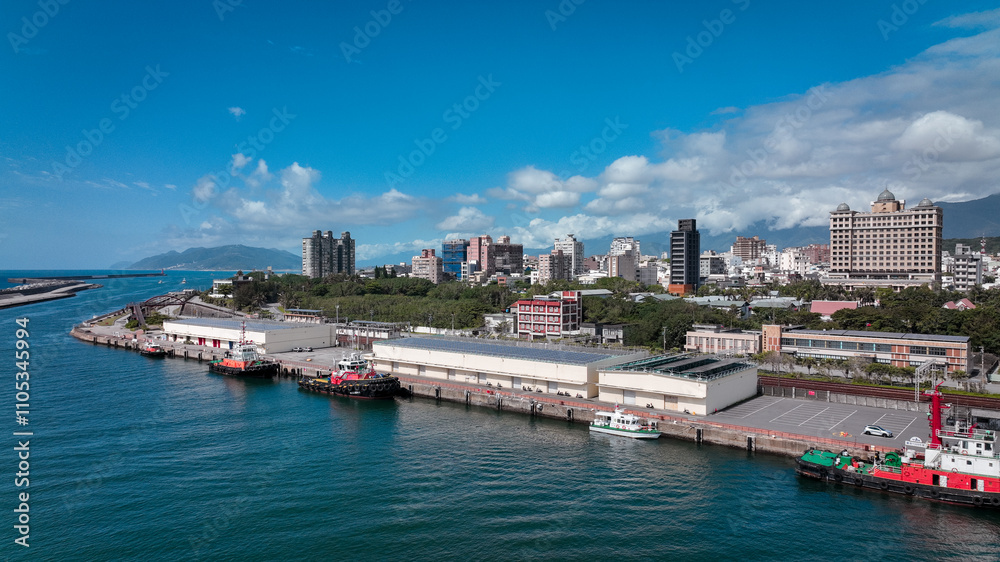 A bustling waterfront in Hualien, Taiwan shows vibrant cityscape and scenic ocean view A bustling waterfront in Hualien, Taiwan shows vibrant cityscape and scenic ocean view