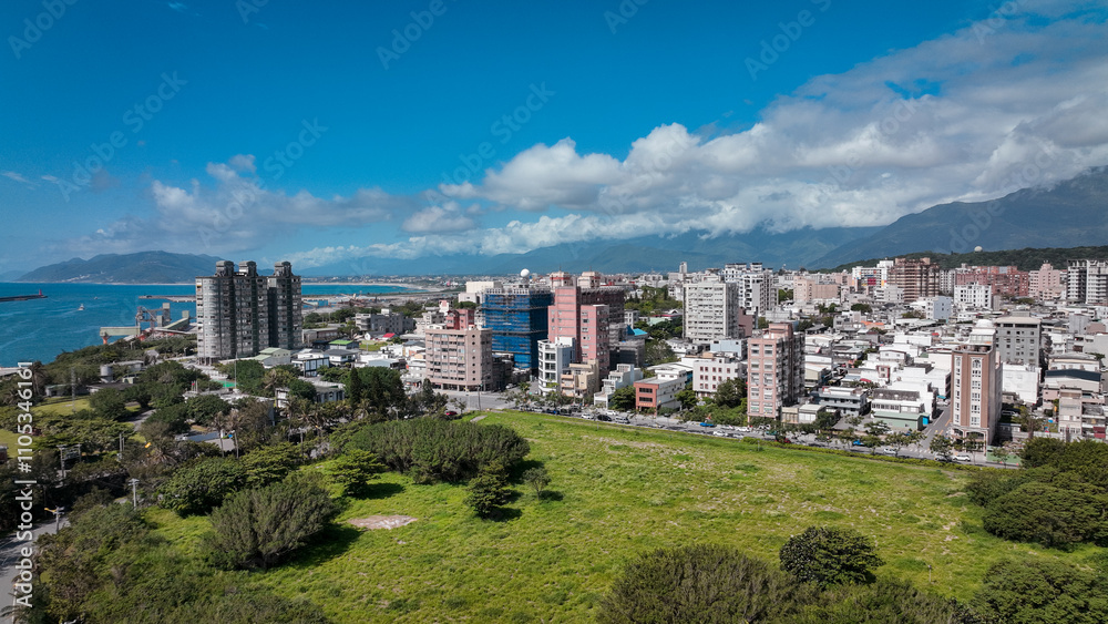 Stunning aerial view of Hualien City showcasing modern buildings and scenic coastal landscape Stunning aerial view of Hualien City showcasing modern buildings and scenic coastal landscape