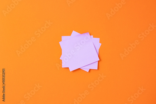 Stack of Pink Sticky Notes on Orange Background