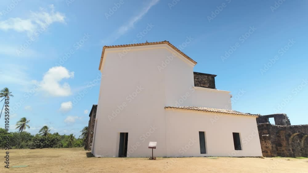 Tracking shot of Beautiful white chapel at Castelo de Avila in Praia do Forte, Brazil Tracking shot of Beautiful white chapel at Castelo de Avila in Praia do Forte, Brazil