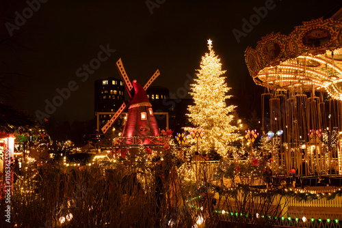 Obraz na plátně Christmas view, Tivoli gardens, decorated Christmas tree, mill, children's carou