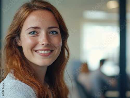 Professional Woman Smiling at the Camera from an Office Setting
