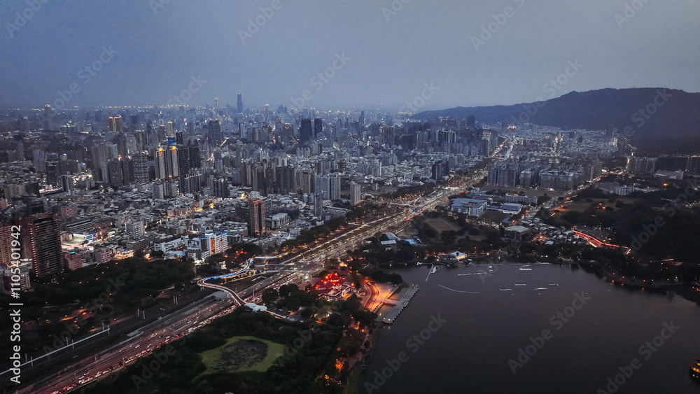 Fototapeta premium Night view of Kaohsiung cityscape with lights reflecting on the waterfront