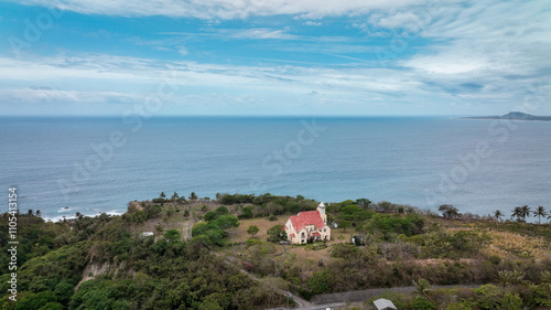 Aerial view of a coastal property in Taiwan featuring a charming structure near the ocean