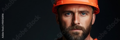 Portrait of a beardless 50-year-old miner in helmet; use earthy tones 