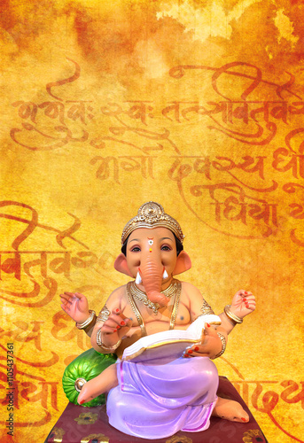 Lord Ganesha on old page sanskrit mantra background  photo