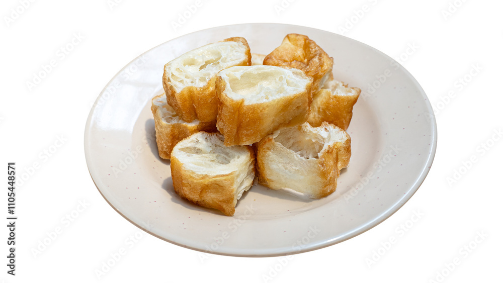 Deep fried dough stick on white dish. Youtiao or Yu Char Kway. Quay. Fried bread stick or popularly known as You Tiao. Deep fried dough stick on white dish. Youtiao or Yu Char Kway. Quay. Fried bread stick or popularly known as You Tiao.