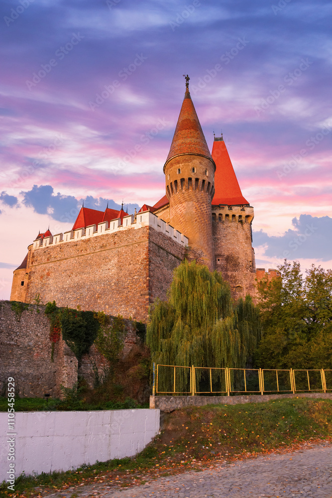 hunedoara, romania - 13 oct, 2019: corvin castle at sunrise. transylvania heritage. myth and history of europe background