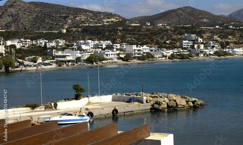 Crete. The city of Makrygialos. Panorama of the central part. Beach and port. photo