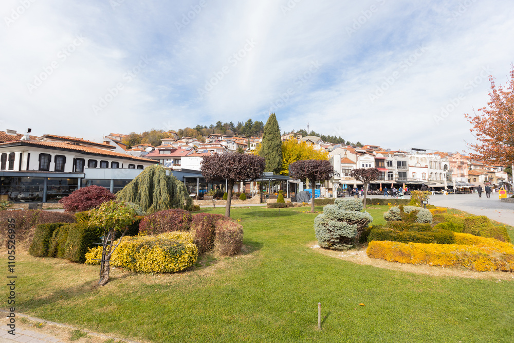 Picturesque view of Ohrid charming streetscape, with colorful buildings, lush greenery. North Macedonia.