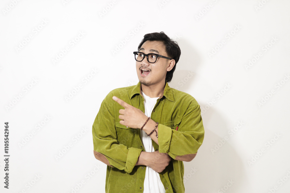 Adult Asian man pointing finger to the right with smiling face isolated on white background Adult Asian man pointing finger to the right with smiling face isolated on white background