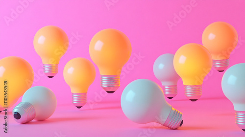 Colorful light bulbs arranged against a vibrant pink background for creative decor