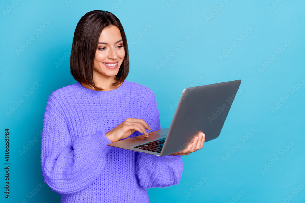 Portrait of attractive cheerful skilled girl using laptop watching video cinema isolated over bright blue color background Portrait of attractive cheerful skilled girl using laptop watching video cinema isolated over bright blue color background
