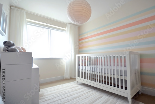 Minimalist baby nursery with a sleek crib, monochrome decor, and an accent wall painted with soft pastel stripes.