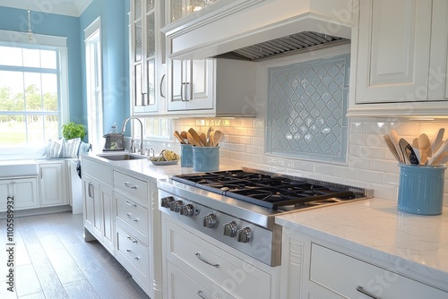 Kitchen with a stove, sink, and blue cabinets photo