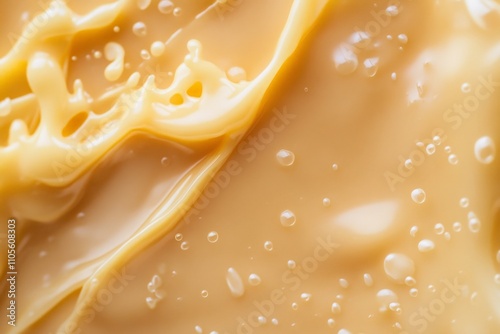 A close-up view of creamy beige liquid filled with entrancing bubbles, highlighting texture and detail, perfect for soft and soothing visual abstractions. photo