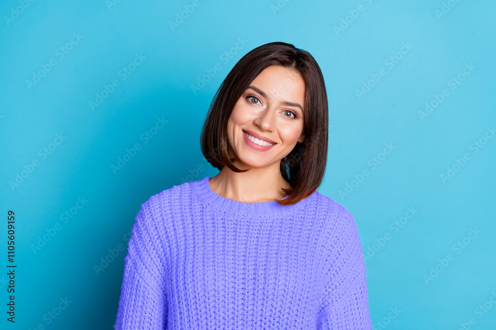 Fototapeta premium Portrait of attractive cheerful funny brunette girl wearing warm jumper wintertime isolated over bright blue color background