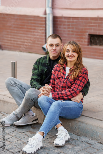 A Joyful Moment Between a Cheerful Couple in a Cozy Urban Setting