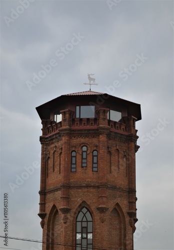 Red brick tower with an outbuilding.