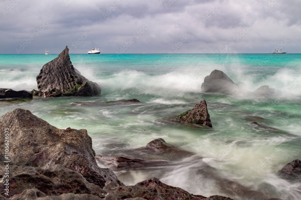 Surf breaking on lava shoreline at Gardner Bay on Espanola Island in the Galapagos Island Archipelago, UNESCO World Heritage Site, Ecuador Surf breaking on lava shoreline at Gardner Bay on Espanola Island in the Galapagos Island Archipelago, UNESCO World Heritage Site, Ecuador
