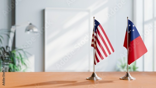 FLAGS OF LIBERIA AND SAMOA ON TABLE photo