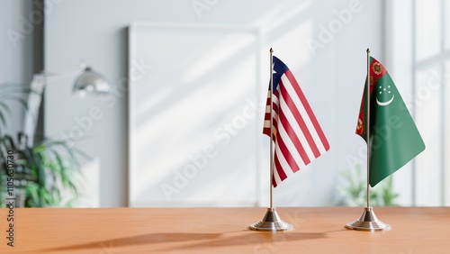 FLAGS OF LIBERIA AND TURKMENISTAN ON TABLE photo