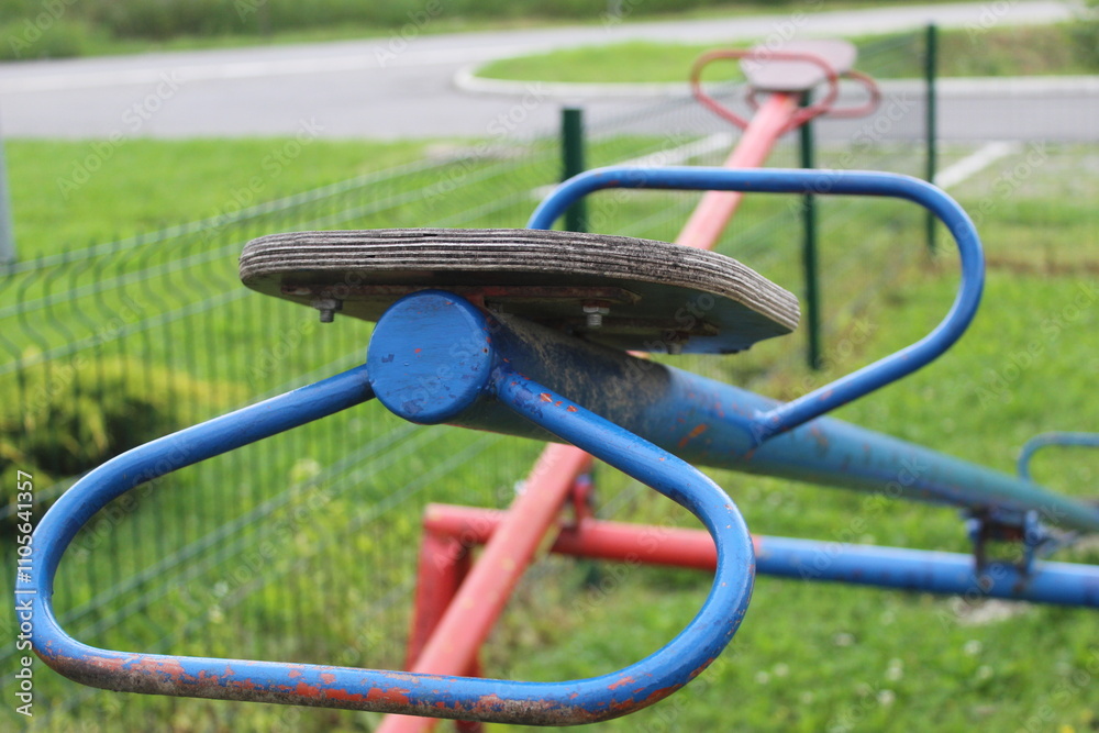 Old metal swing balancer close-up on the playground outdoor Old metal swing balancer close-up on the playground outdoor