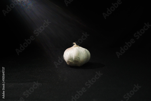 garlic and onion on black background