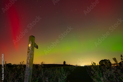 View of Northern Lights (Aurora borealis) and signpost near the village of Glapwell, Bolsover, Derbyshire, England, United Kingdom photo