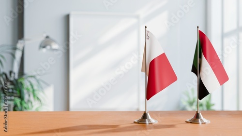 FLAGS OF MALTA AND SUDAN ON TABLE photo