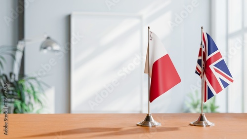 FLAGS OF MALTA AND UNITED KINGDOM ON TABLE photo