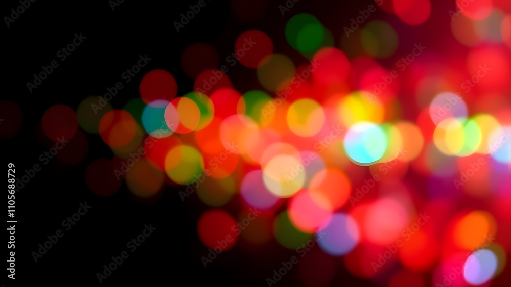 Abstract colorful bokeh with vivid red, green, and blue lights floating on a black grad Abstract colorful bokeh with vivid red, green, and blue lights floating on a black grad