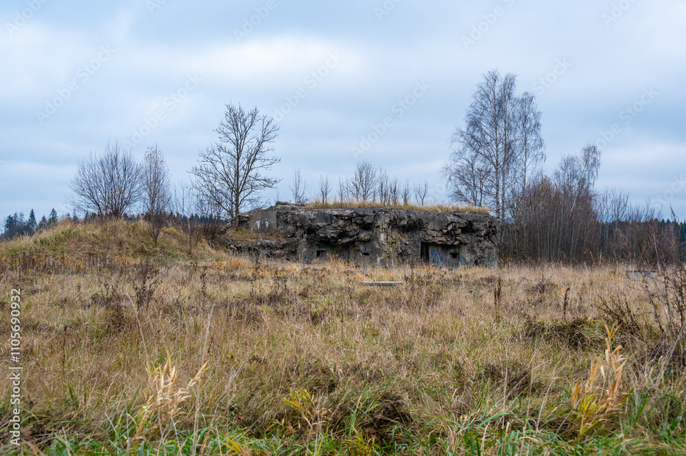 A historical image of a well-preserved infantry bunker near the town of Kraliky, showcasing its solid concrete structure and significance as a part of Czechoslovakia's wartime fortifications.