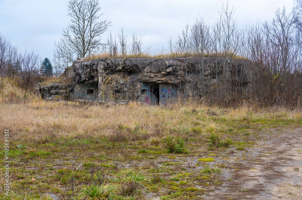 A historical image of a well-preserved infantry bunker near the town of Kraliky, showcasing its solid concrete structure and significance as a part of Czechoslovakia's wartime fortifications.
