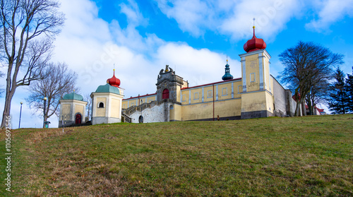 Obraz na płótnie A beautiful view of the Monastery of Our Lady of the Mountain in Hedec, showcasing its historic architecture set against a tranquil natural backdrop, reflecting peace and spirituality w salonie