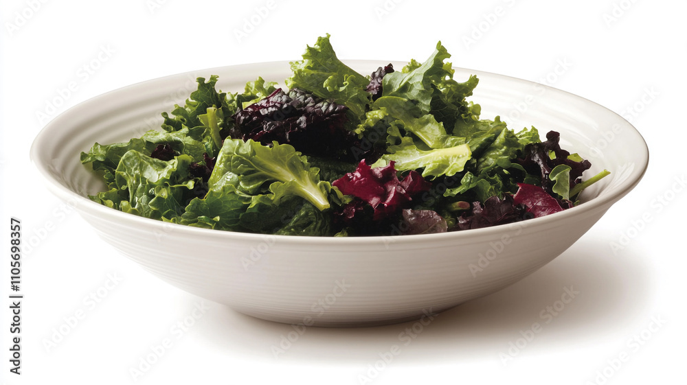 A white bowl containing a salad with mixed greens, and green leafy vegetables on a white background A white bowl containing a salad with mixed greens, and green leafy vegetables on a white background