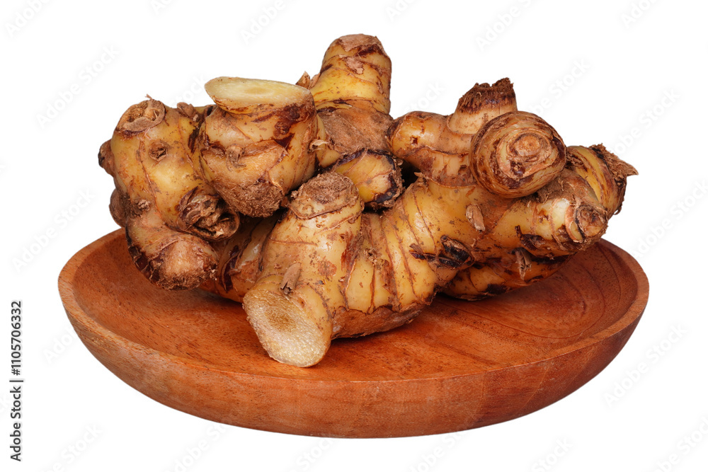 Galangal root on a wooden plate isolated transparent Galangal root on a wooden plate isolated transparent